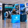 10x10 FlexPop™ Trade Show Booth with Curved Wall and Monitor Display Table