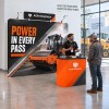 10x10 Straight FlexZip™ Trade Show Booth with Header and Podium Counter
