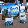 10x10 FlexZip™ Trade Show Booth with Straight Wall, Monitor Table and Header