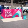 10x20 Straight FlexZip™ Trade Show Booth with Full Backwall and Podium Counter