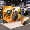 10x10 Modular FlexZip™ Media Trade Show Booth with TV Mount and Shelving