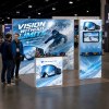 10x10 ProFrame™ SEG Lightbox Trade Show Booth with TV Mount and Display Shelf