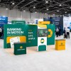 10x20 Straight FlexZip™ Trade Show Booth with L-Shaped Display, TV Mount and Two Headers